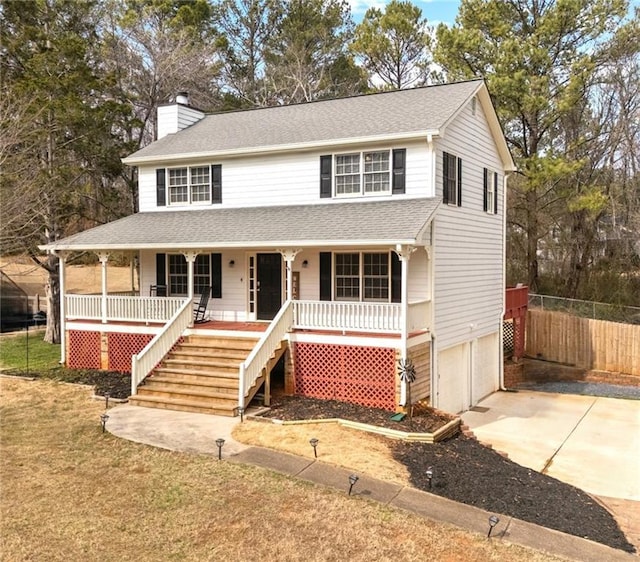 view of front of home featuring a garage and a porch