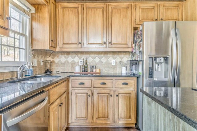 kitchen featuring stainless steel appliances, dark countertops, decorative backsplash, dark wood-type flooring, and ornamental molding