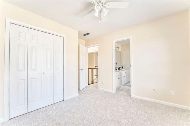 full bath with double vanity, visible vents, toilet, tile patterned flooring, and a sink