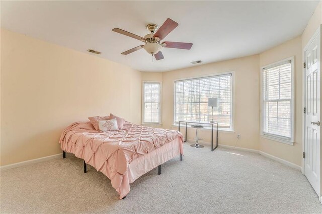 unfurnished bedroom with connected bathroom, light carpet, visible vents, baseboards, and a closet