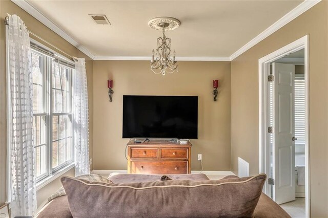 bedroom with carpet floors, a raised ceiling, visible vents, and ornamental molding