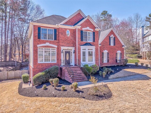 view of front of house featuring a shingled roof, french doors, covered porch, and a chimney