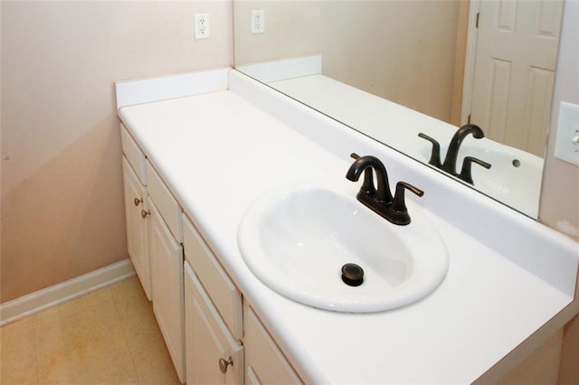 bathroom with tile patterned floors and vanity