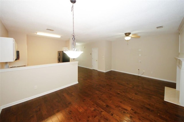 unfurnished room featuring dark hardwood / wood-style flooring and ceiling fan