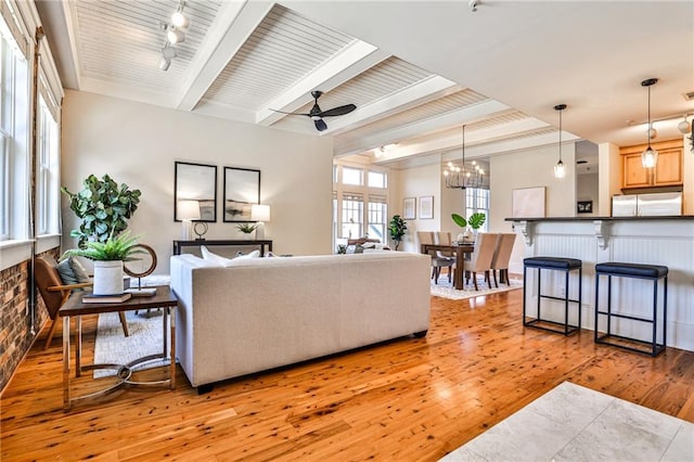 living room featuring light hardwood / wood-style floors, wooden ceiling, beam ceiling, and ceiling fan