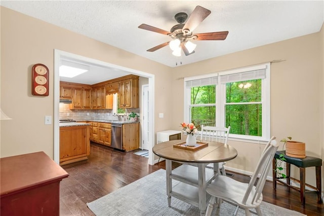 3012 Cypress Cv, Ball Ground, GA 30107 - dining area with a ceiling fan and dark wood-type flooring