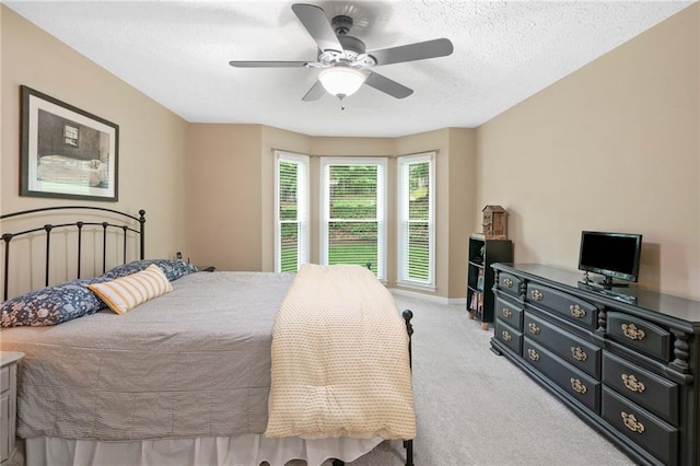 3012 Cypress Cv, Ball Ground, GA 30107 - bedroom with light colored carpet, baseboards, ceiling fan, and a textured ceiling