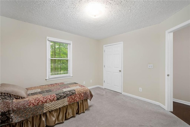 3012 Cypress Cv, Ball Ground, GA 30107 - bedroom with carpet flooring, a textured ceiling, and baseboards