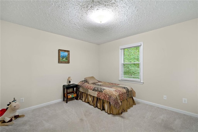 3012 Cypress Cv, Ball Ground, GA 30107 - carpeted bedroom with baseboards and a textured ceiling