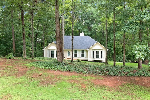 3012 Cypress Cv, Ball Ground, GA 30107 - view of front of house featuring a chimney and a forest view