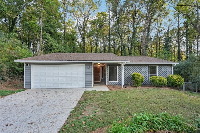 ranch-style home with a front yard and a garage