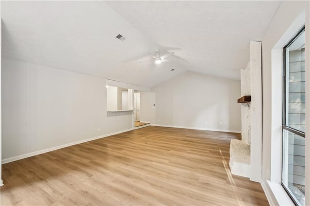 additional living space featuring ceiling fan, light wood-type flooring, and vaulted ceiling