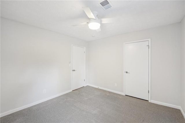 empty room with light carpet and ceiling fan