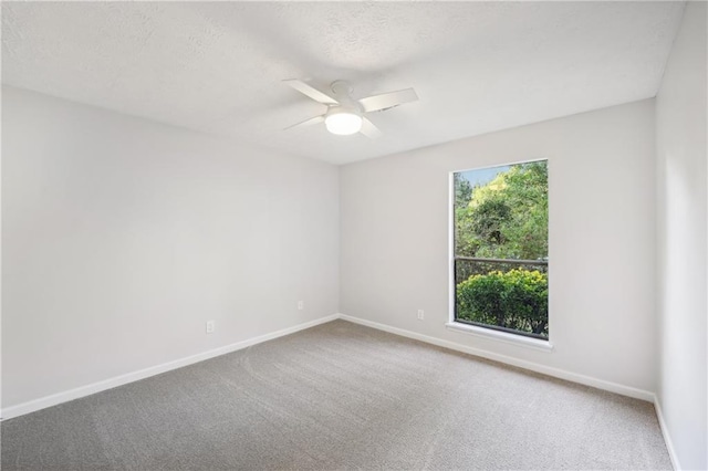 unfurnished room with carpet and ceiling fan