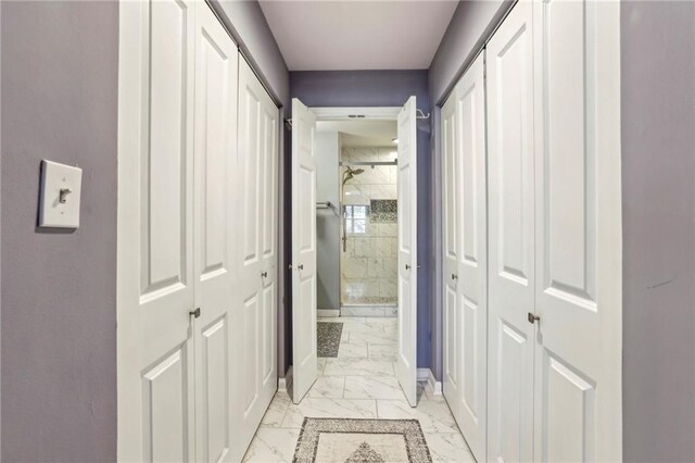 64 Devon Ln, Avondale Estates, GA 30002 - hallway featuring light marble finish floors and baseboards
