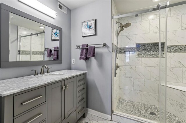64 Devon Ln, Avondale Estates, GA 30002 - full bath featuring marble finish flooring, a stall shower, vanity, and baseboards