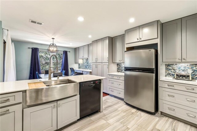 64 Devon Ln, Avondale Estates, GA 30002 - kitchen with freestanding refrigerator, black dishwasher, gray cabinets, a sink, and recessed lighting