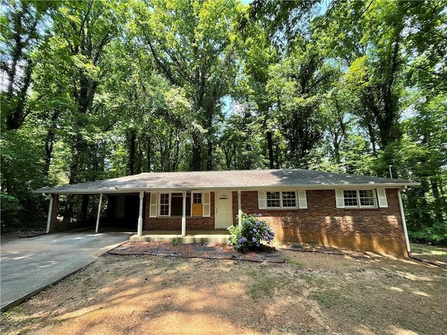 6106 Oak Hill Dr SW, Austell, GA 30168 - single story home with brick siding, a porch, concrete driveway, and an attached carport