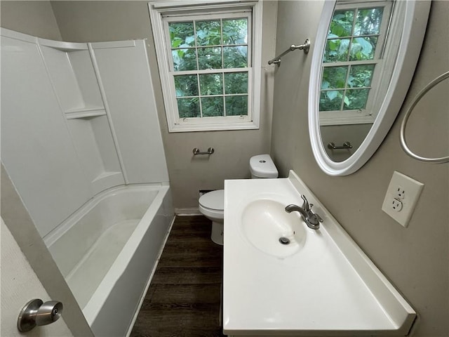 6106 Oak Hill Dr SW, Austell, GA 30168 - bathroom with toilet, wood finished floors, baseboards, shower / bath combination, and vanity
