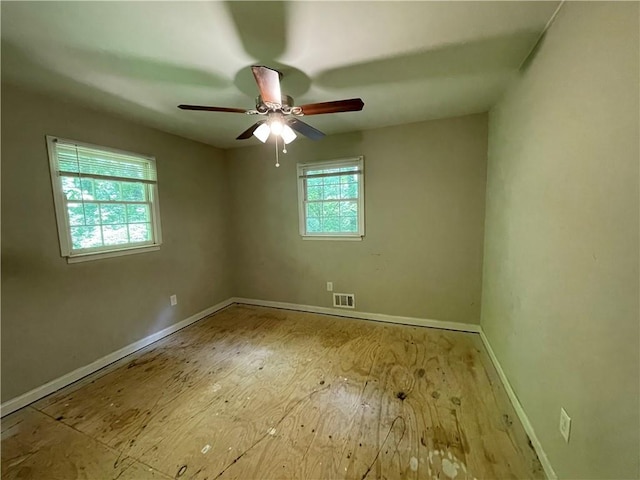 6106 Oak Hill Dr SW, Austell, GA 30168 - spare room featuring baseboards, ceiling fan, and wood finished floors
