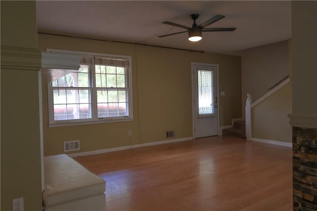 living room featuring light hardwood / wood-style floors and ceiling fan