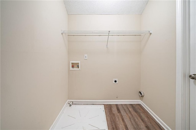 laundry room featuring laundry area, hookup for a gas dryer, wood finished floors, washer hookup, and electric dryer hookup