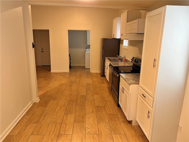 701 Cameron M Alexander Blvd NW, Atlanta, GA 30318 - kitchen with stainless steel appliances, washer / clothes dryer, a sink, light wood-type flooring, and white cabinetry