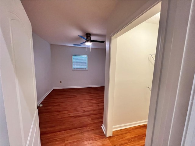 701 Cameron M Alexander Blvd NW, Atlanta, GA 30318 - unfurnished room with wood finished floors, baseboards, and ceiling fan