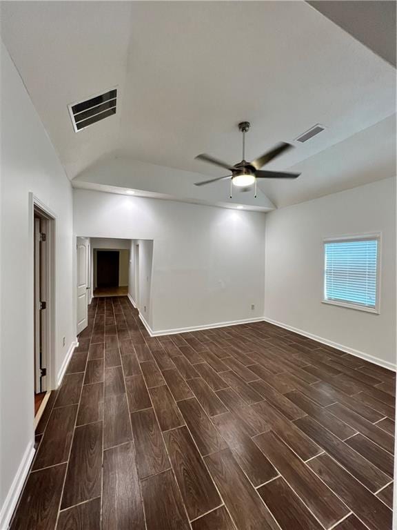 701 Cameron M Alexander Blvd NW, Atlanta, GA 30318 - spare room with dark wood-type flooring, a ceiling fan, vaulted ceiling, and baseboards