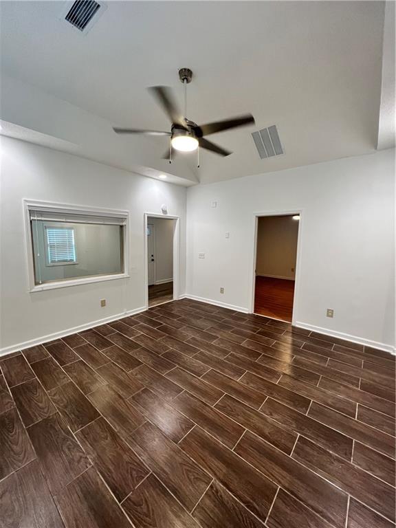 701 Cameron M Alexander Blvd NW, Atlanta, GA 30318 - empty room featuring wood finish floors, a ceiling fan, and baseboards