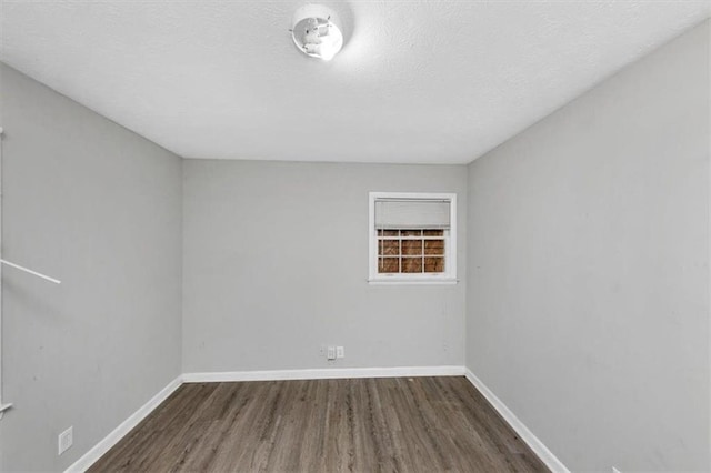 5267 Sheppard Ln, Stone Mountain, GA 30083 - spare room featuring wood finished floors, a smoke detector, and a textured ceiling