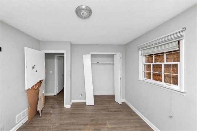 5267 Sheppard Ln, Stone Mountain, GA 30083 - unfurnished bedroom with wood finished floors and a closet
