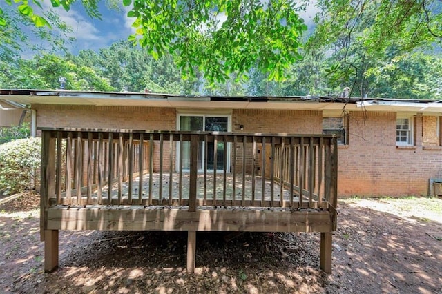 5267 Sheppard Ln, Stone Mountain, GA 30083 - rear view of house with brick siding and a wooden deck