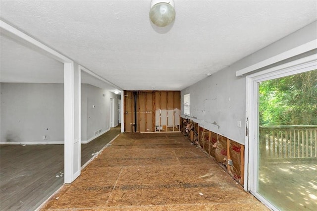 5267 Sheppard Ln, Stone Mountain, GA 30083 - corridor featuring a textured ceiling
