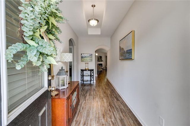 hall with dark wood-type flooring