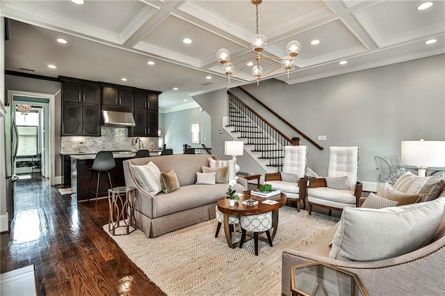 living area featuring ornamental molding, stairway, coffered ceiling, and recessed lighting