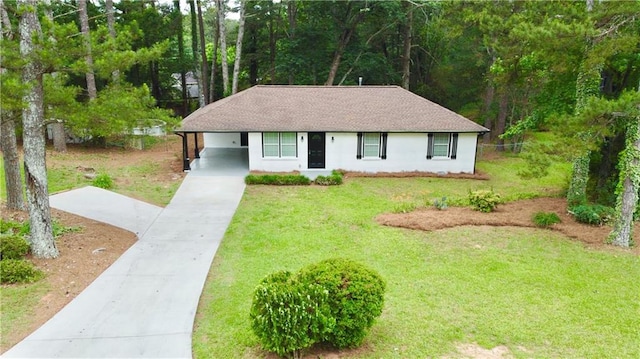 537 Eastside Dr, Dacula, GA 30019 - view of front facade with driveway, a front lawn, a carport, a shingled roof, and stucco siding
