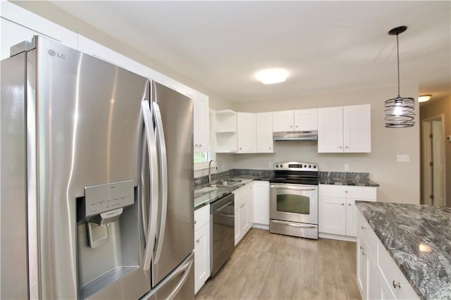 537 Eastside Dr, Dacula, GA 30019 - kitchen featuring appliances with stainless steel finishes, under cabinet range hood, light wood-style flooring, a sink, and white cabinetry