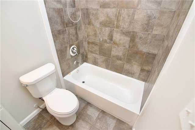537 Eastside Dr, Dacula, GA 30019 - full bath with toilet, washtub / shower combination, baseboards, and tile patterned floors