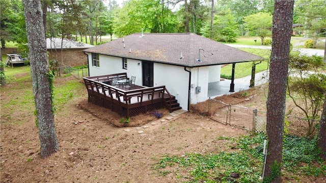 537 Eastside Dr, Dacula, GA 30019 - back of property with a shingled roof, a wooden deck, stucco siding, and a gate