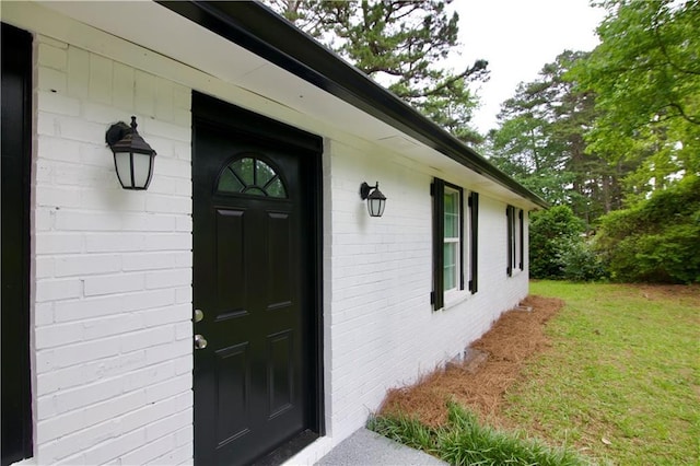 537 Eastside Dr, Dacula, GA 30019 - property entrance featuring a yard and brick siding