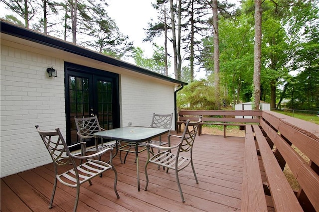 537 Eastside Dr, Dacula, GA 30019 - wooden deck with french doors and outdoor dining area
