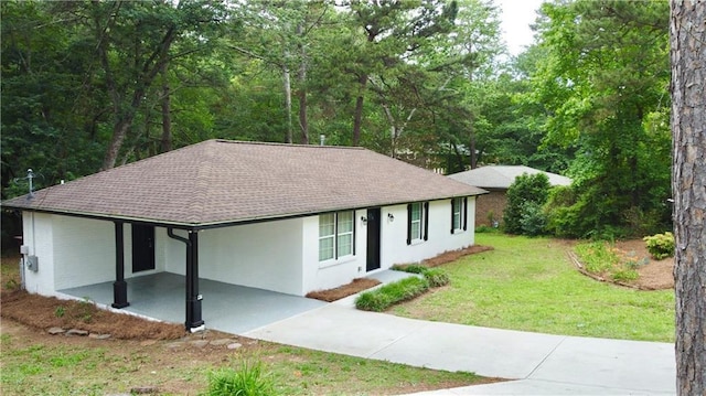 537 Eastside Dr, Dacula, GA 30019 - single story home with concrete driveway, a carport, a front lawn, a shingled roof, and stucco siding