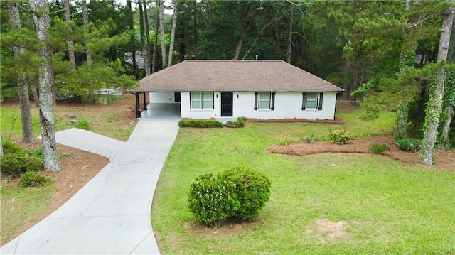 537 Eastside Dr, Dacula, GA 30019 - ranch-style home featuring driveway, a front yard, a carport, stucco siding, and roof with shingles