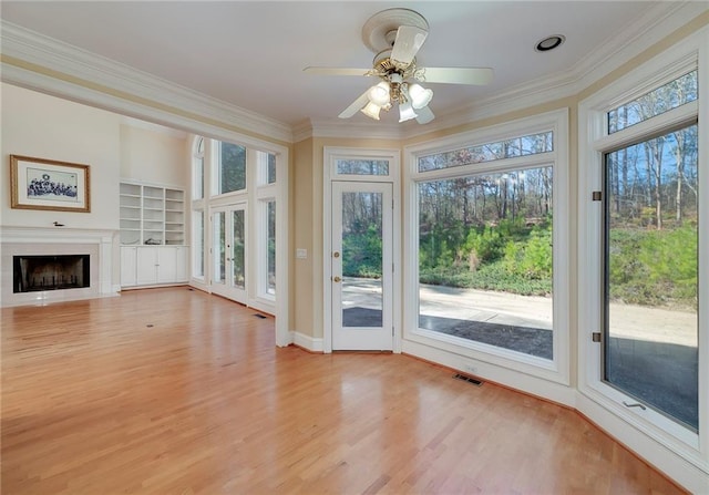 unfurnished sunroom with visible vents