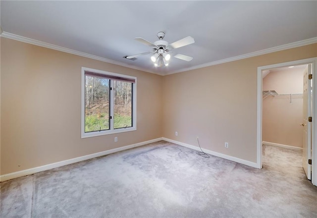 unfurnished bedroom with light colored carpet, baseboards, and ornamental molding