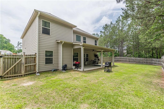 446 Vandenburg Dr, Villa Rica, GA 30180 - back of property with a ceiling fan, a patio, and a gate