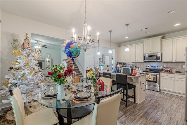 446 Vandenburg Dr, Villa Rica, GA 30180 - dining space with a chandelier, light wood-style flooring, stairs, ceiling fan, and recessed lighting