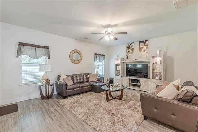 446 Vandenburg Dr, Villa Rica, GA 30180 - living area featuring wood finished floors, ceiling fan, and baseboards
