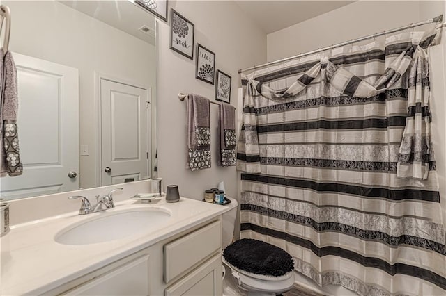 446 Vandenburg Dr, Villa Rica, GA 30180 - bathroom with vanity, toilet, and a shower with curtain